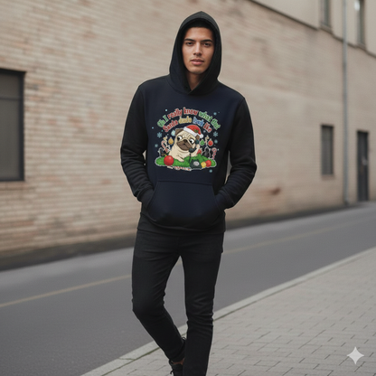 Person wearing a navy blue hoodie with a colorful graphic design on a street.
