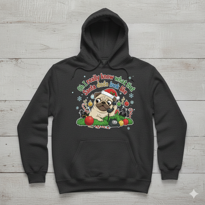 Black hoodie with a pug graphic and text on a wooden surface